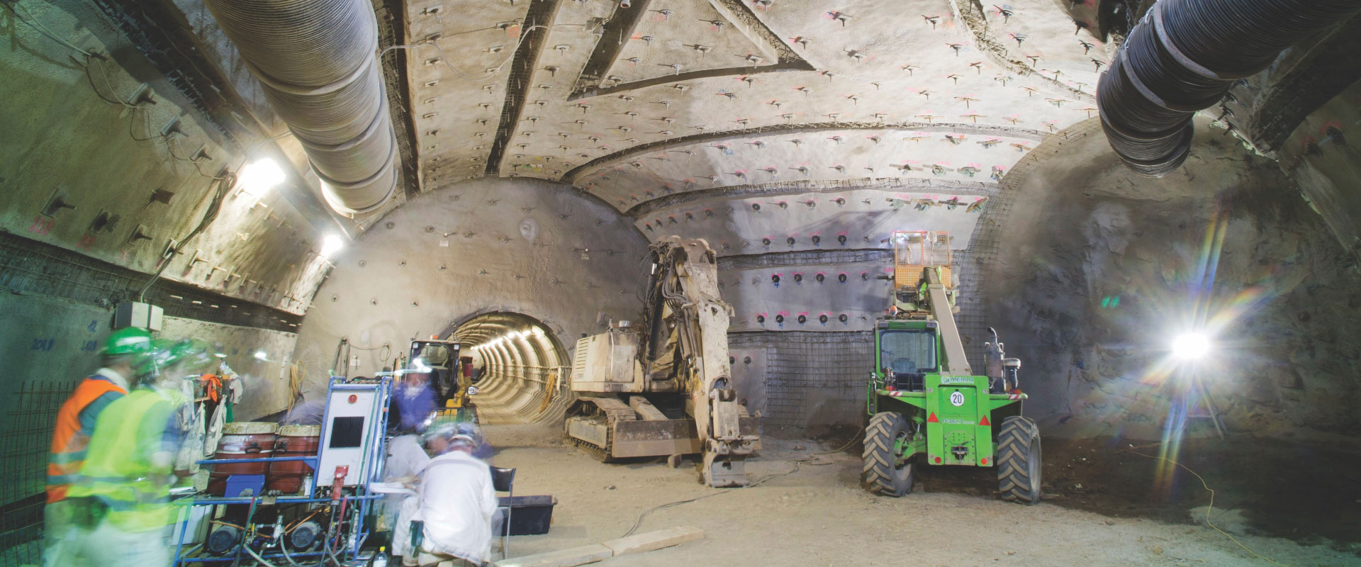 Redpath employees deep underground performing mass excavation using lateral and vertical development specialty techniques.